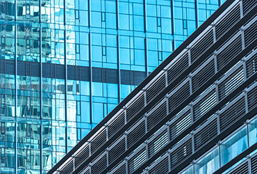 High-performance glass facade for commercial buildings by Pride Windoor Systems
